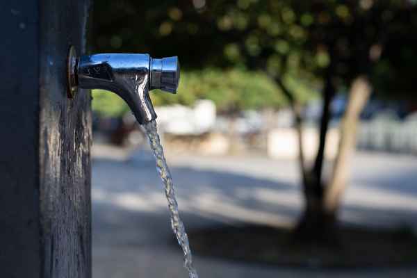 A water faucet flowing into a park